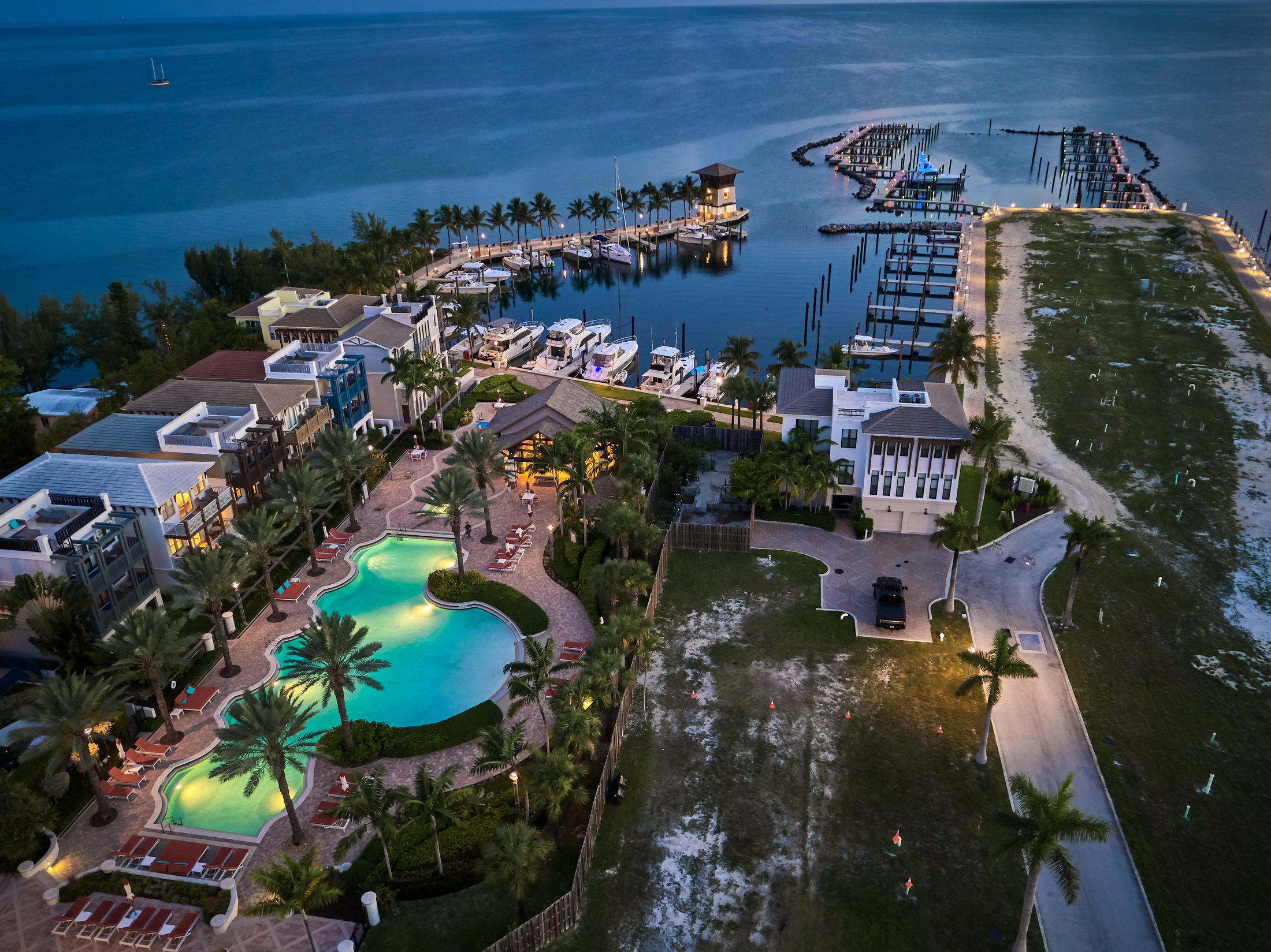 Marlin Bay at twilight, the marina and pool lit against the water